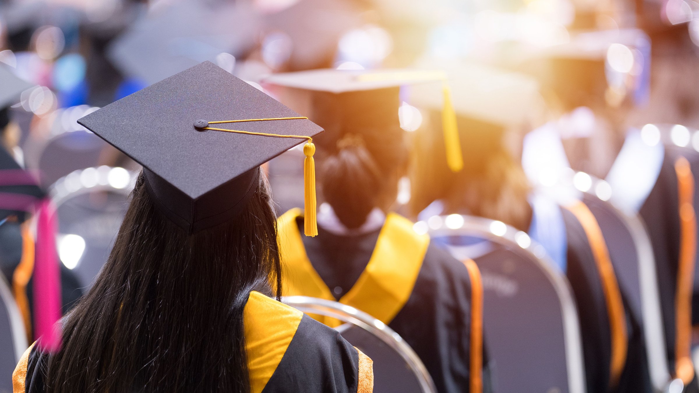 Graduate wearing the cap and gown during the ceremony